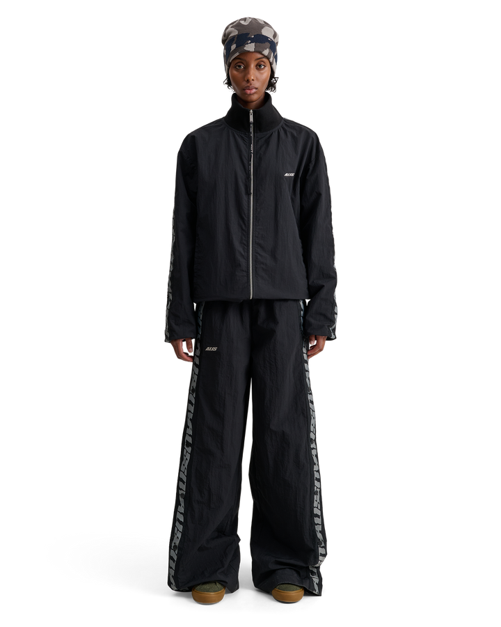 ALIS TEEFEY TRACK PANTS W/ LOGO TAPE Trousers